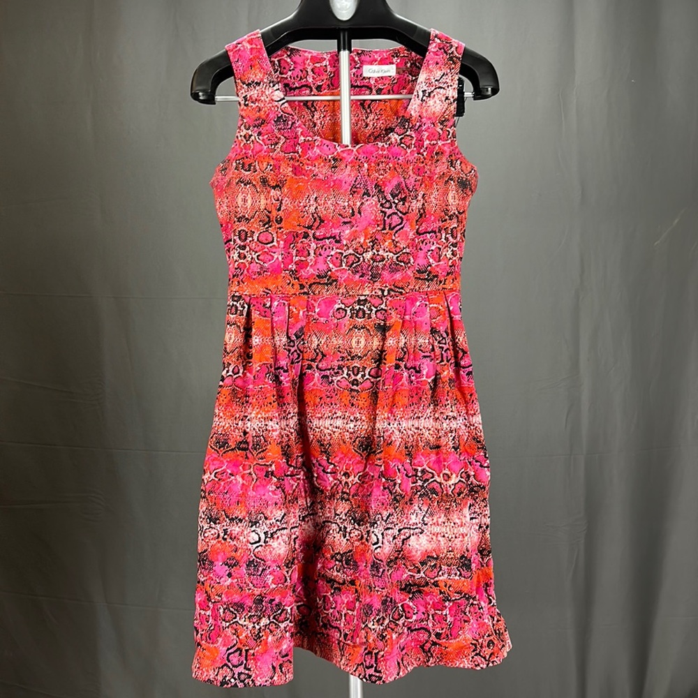 Red Calvin Klein dress with a snakeskin pattern. The dress is a size 8.